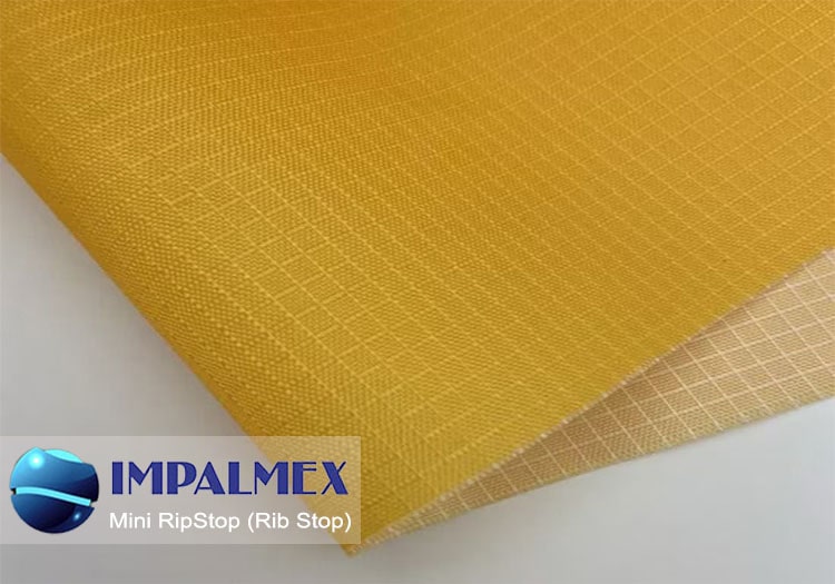 Mini Rib Stop en poliéster, impermeable, ligera y con textura cuadriculada; utilizada en estuches escolares, petacas compactas y fundas ergonómicas.
